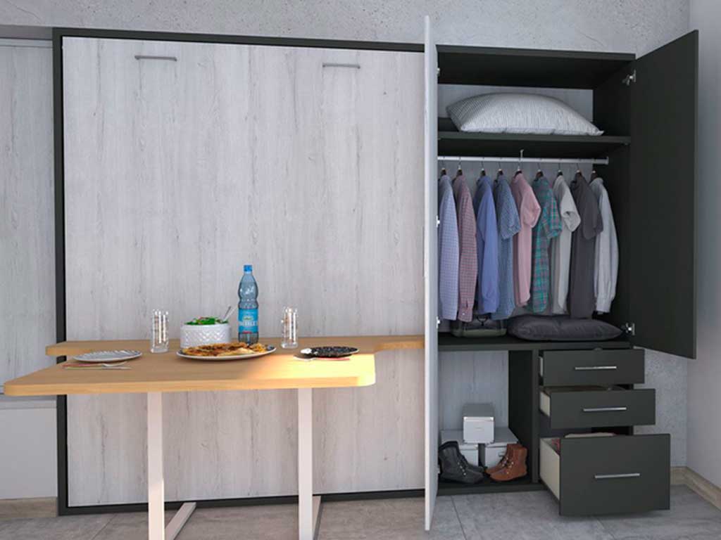 Cama abatible de matrimonio con mesa de salón abatible incoporada.